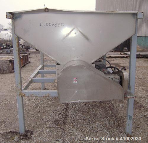 Used Dewatering Screw Conveyor, 304 stainless steel. 16" diameter x 106" long x 4 1/2" pitch screw, perforated bottom trough with 1/2" diameter holes. Top mounted hopper 62" wide x 105" long x 28" de...