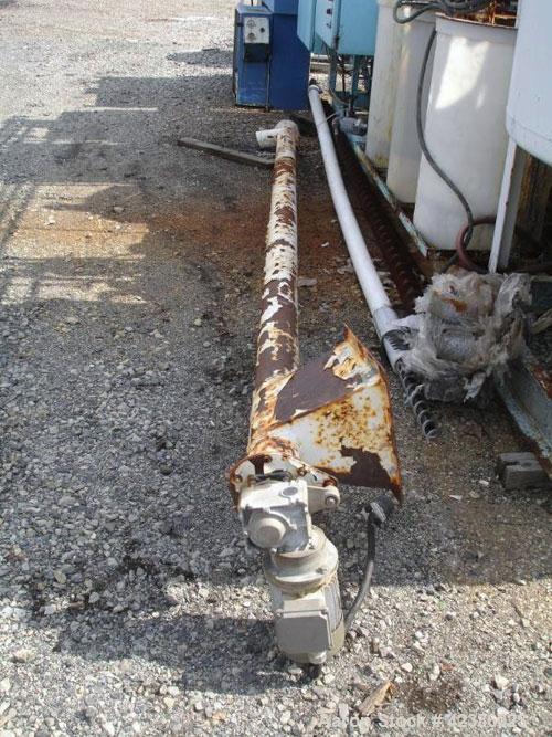 Used Screw Conveyor, Carbon Steel. Approximately 4" diameter x 15' long. 4" diameter carbon steel tube, 10" x 12" feed, 5" discharge with 1 hp, 330/575 volt motor drive.