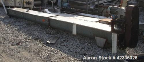 Used Screw Conveyor, Carbon Steel. Approximately 12" diameter x 21' long. 12" Piched flight. 14" x 14" Discharge. 3 hp, 330/575 volt motor drive.