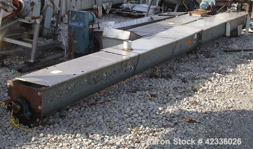 Used Screw Conveyor, Carbon Steel. Approximately 12" diameter x 21' long. 12" Piched flight. 14" x 14" Discharge. 3 hp, 330/575 volt motor drive.