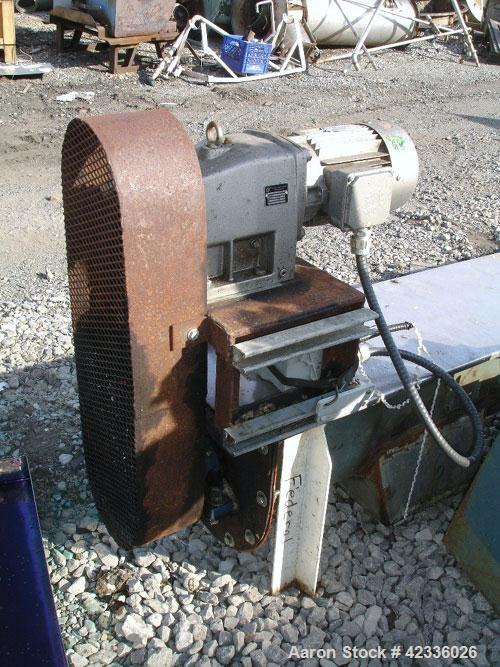 Used Screw Conveyor, Carbon Steel. Approximately 12" diameter x 21' long. 12" Piched flight. 14" x 14" Discharge. 3 hp, 330/575 volt motor drive.