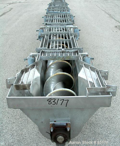 USED: Screw Conveyor, 304 stainless steel, horizontal. 14" diameter x 26' long x 6" pitch screw. Approximately 1/2" thick Teflon screw tip. Top feed, end bottom outlet. Top safety grate sections, 5 a...