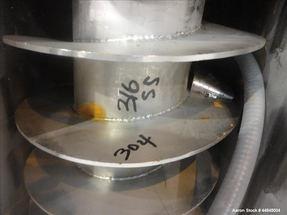 Used Ohio Inclined Screw Conveyor, 304 Stainless Steel. Approximate 12" diameter x 239" long x 3-1/2" pitch cored screw, driven by a 2 hp, 180 volt, 1750 rpm gear motor, no gear ratio. Jacketed troug...