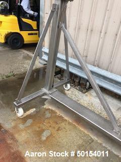 Used- S. Howes Inclined Screw Conveyor, Model 6SC20, Stainless Steel. Approximate 6" diameter x 20' long screw. 8' discharge...