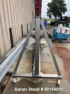 Used- S. Howes Inclined Screw Conveyor, Model 6SC20, Stainless Steel. Approximate 6" diameter x 20' long screw. 8' discharge...