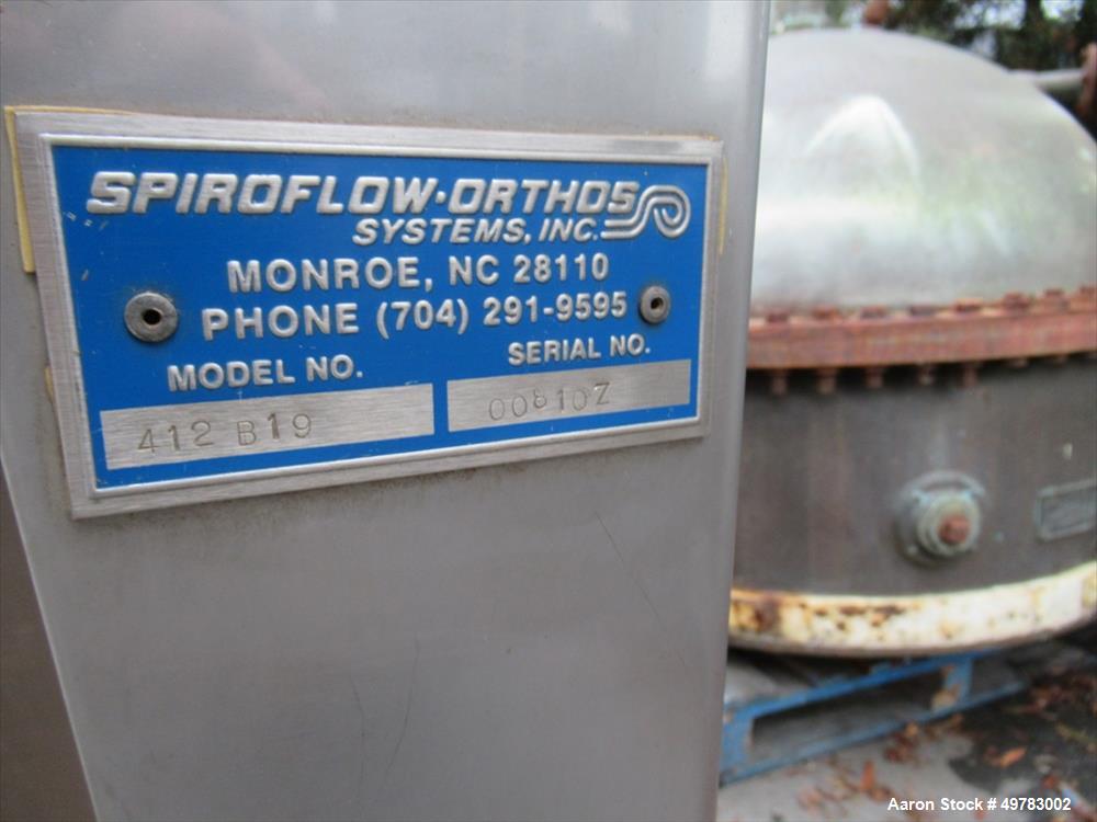 Used Spiroflow Stainless Steel Flexible Screw Conveyor, Model 412B19. Approximate 3" diameter x 20' long screw, inside 4" diameter stainless steel pipe/tube. Driven by a 5hp, 3/60/230/460 volt, 1740 ...
