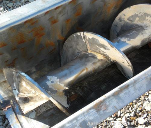Used Thomas Conveyor Screw Conveyor, 316 Stainless Steel, Horizontal. 8" diameter x 213" long x 4" pitch screw. 10" end top feed, 10" x 10" end bottom outlet.Top bolt on cover with (2) 10" x 10" open...