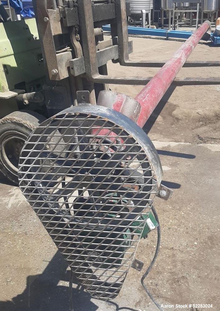Used Screw Conveyor with Explosion proof motor and carbon steel hopper. Includes 4" diameter x 14'6" long screw, carbon steel conveyor tube measuring 15' long with 5" diameter discharge, and carbon s...