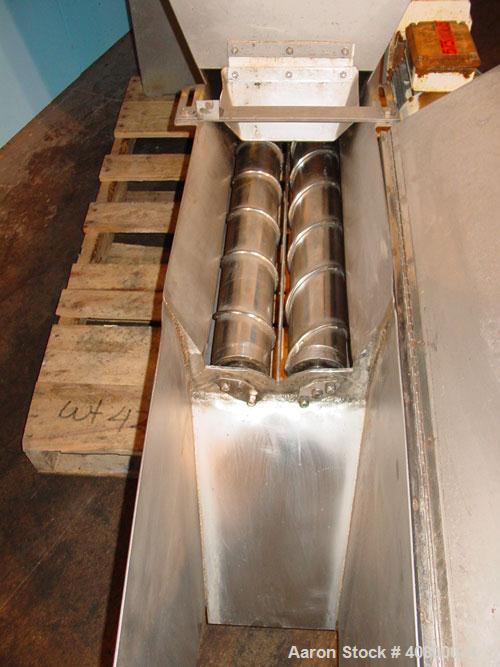 Used Vanmark Potato Feeder. (2) Approximate 3 1/2" diameter x 42" long side-by-side 316 stainless steel screws. Top feed with hopper, end bottom outlet. Driven by a 1 hp, 3/60/330/575 volt, 1700 rpm ...