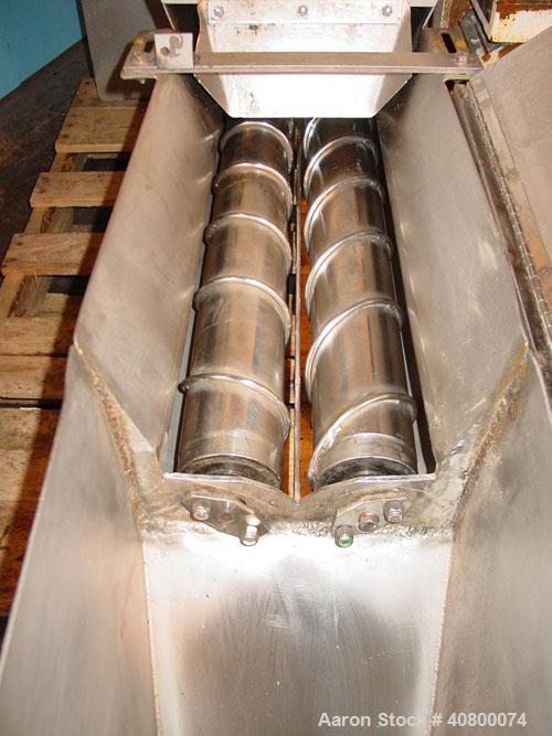 Used Vanmark Potato Feeder. (2) Approximate 3 1/2" diameter x 42" long side-by-side 316 stainless steel screws. Top feed with hopper, end bottom outlet. Driven by a 1 hp, 3/60/330/575 volt, 1700 rpm ...