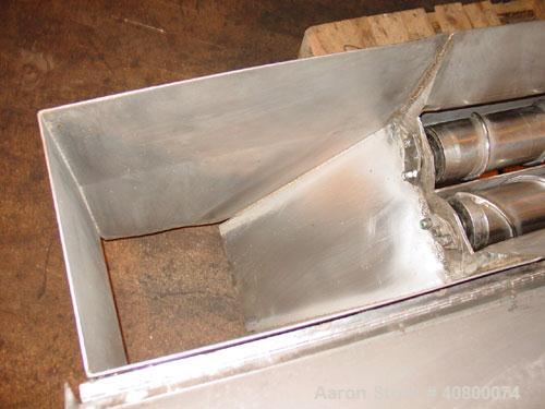 Used Vanmark Potato Feeder. (2) Approximate 3 1/2" diameter x 42" long side-by-side 316 stainless steel screws. Top feed with hopper, end bottom outlet. Driven by a 1 hp, 3/60/330/575 volt, 1700 rpm ...