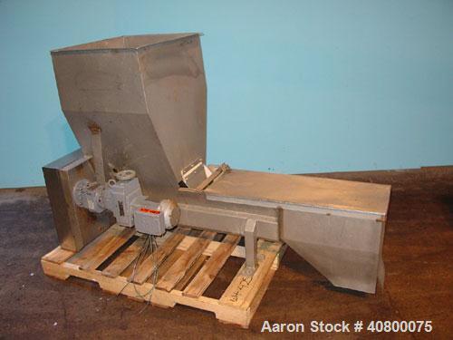 Used Vanmark Potato Feeder. (2) Approximate 3 1/2'' diameter x 42'' long side-by-side 316 stainless steel screws. Top feed with hopper, end bottom outlet. Driven by a 1 hp, 3/60/330/575 volt, 1700 rp...