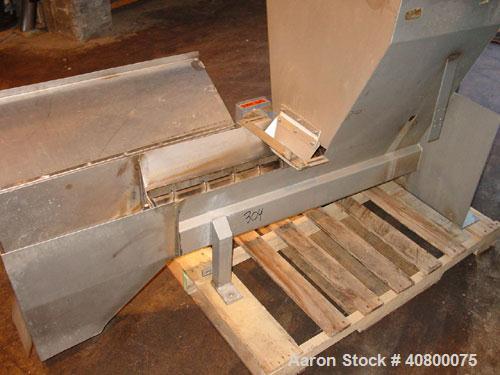 Used Vanmark Potato Feeder. (2) Approximate 3 1/2'' diameter x 42'' long side-by-side 316 stainless steel screws. Top feed with hopper, end bottom outlet. Driven by a 1 hp, 3/60/330/575 volt, 1700 rp...