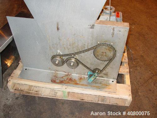 Used Vanmark Potato Feeder. (2) Approximate 3 1/2'' diameter x 42'' long side-by-side 316 stainless steel screws. Top feed with hopper, end bottom outlet. Driven by a 1 hp, 3/60/330/575 volt, 1700 rp...