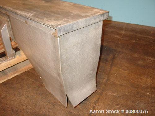 Used Vanmark Potato Feeder. (2) Approximate 3 1/2'' diameter x 42'' long side-by-side 316 stainless steel screws. Top feed with hopper, end bottom outlet. Driven by a 1 hp, 3/60/330/575 volt, 1700 rp...