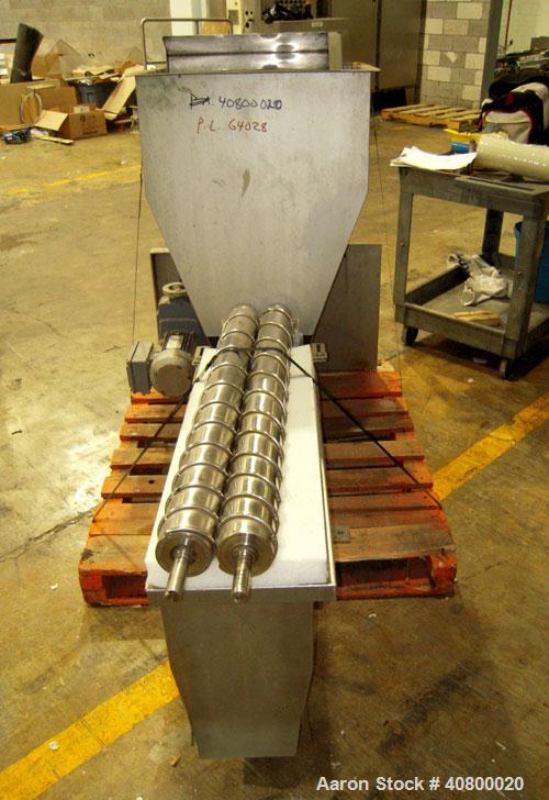 Used Vanmark Potato Feeder. (2) Approximate 3 1/2" diameter x 42" long side-by-side 316 stainless steel screws. Top feed with hopper, end bottom outlet. Driven by a 1 hp, 3/60/330/575 volt, 1700 rpm ...