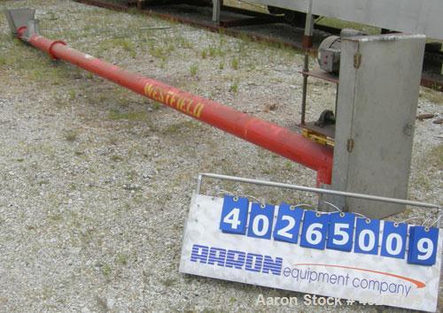 Used Westfield Industries Screw Conveyor, carbon steel. 6" diameter x 21' long x 5" pitch screw. Aproximate 6 1/4" diameter enclosed tube. 14" x 14" feed hopper, 7 1/2" end bottom outlet. Driven by a...