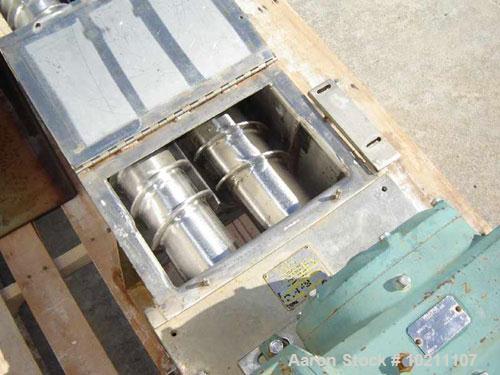 Used 6" X 56" Wyssmont Stainless Steel Twin Screw Feeder. Trough width 13", graduated flighting from 1.5" to 3" centers. Discharge is 13" X 5" on drive end. Unit is driven by a Reliance Electric AC i...
