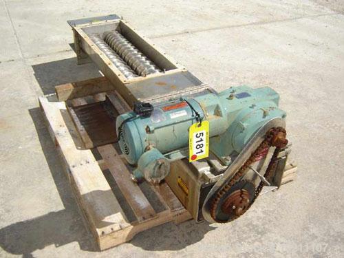 Used 6" X 56" Wyssmont Stainless Steel Twin Screw Feeder. Trough width 13", graduated flighting from 1.5" to 3" centers. Discharge is 13" X 5" on drive end. Unit is driven by a Reliance Electric AC i...