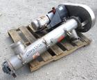 Used Enclosed Tube Screw Conveyor, Stainless Steel. 6'' Diameter x 28'' long 304 stainless steel screw. 301 Stainless steel tube approximately 7'' diameter x 48'' long, side access door, 6'' inlet/ou...