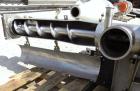 Used Enclosed Tube Screw Conveyor, Stainless Steel. 6'' Diameter x 28'' long 304 stainless steel screw. 301 Stainless steel tube approximately 7'' diameter x 48'' long, side access door, 6'' inlet/ou...