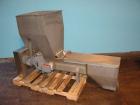 Used Vanmark Potato Feeder. (2) Approximate 3 1/2'' diameter x 42'' long side-by-side 316 stainless steel screws. Top feed with hopper, end bottom outlet. Driven by a 1 hp, 3/60/330/575 volt, 1700 rp...