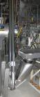 Used Young Industire Transvair Mechanical Cable-Puck Tube Conveyor, Model 3TNCH, Stainless Steel. Approximately 20' long.