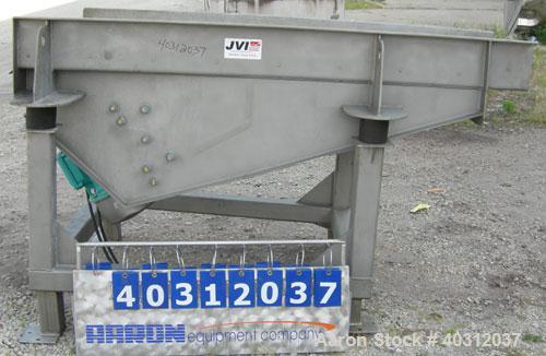Used JVI vibratory conveyor, Model FUF1000X600X200X2150, stainless steel. Tapered bed 39 1/2" wide to 24" wide x 7' long. 304 stainless steel fixed liner. 8" tall sides. Driven by (2) 2.25 hp, 3/60/2...