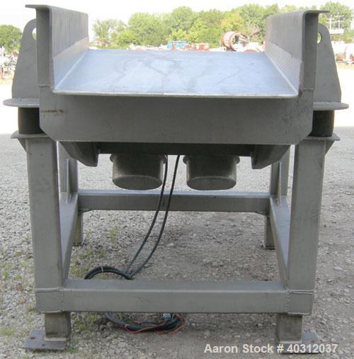 Used JVI vibratory conveyor, Model FUF1000X600X200X2150, stainless steel. Tapered bed 39 1/2" wide to 24" wide x 7' long. 304 stainless steel fixed liner. 8" tall sides. Driven by (2) 2.25 hp, 3/60/2...