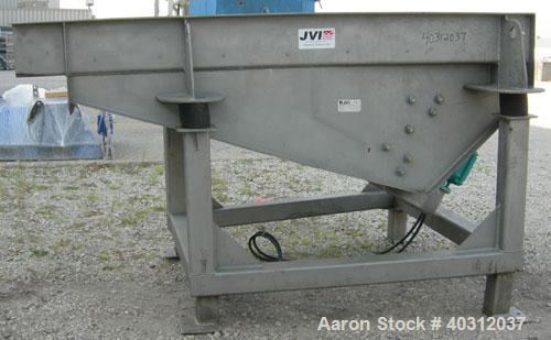 Used JVI vibratory conveyor, Model FUF1000X600X200X2150, stainless steel. Tapered bed 39 1/2" wide to 24" wide x 7' long. 304 stainless steel fixed liner. 8" tall sides. Driven by (2) 2.25 hp, 3/60/2...