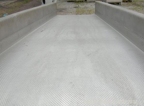 Used JVI vibratory conveyor, Model FUF1000X600X200X2150, stainless steel. Tapered bed 39 1/2" wide to 24" wide x 7' long. 304 stainless steel fixed liner. 8" tall sides. Driven by (2) 2.25 hp, 3/60/2...