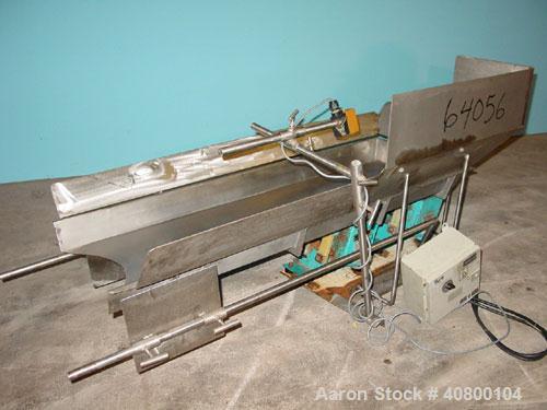 Used H Tech Vibratory Conveyor, stainless steel. 16'' wide x 42'' long x 3'' high sides vibrating pan. Syntron speed controller. Mounted on a carbon steel base.