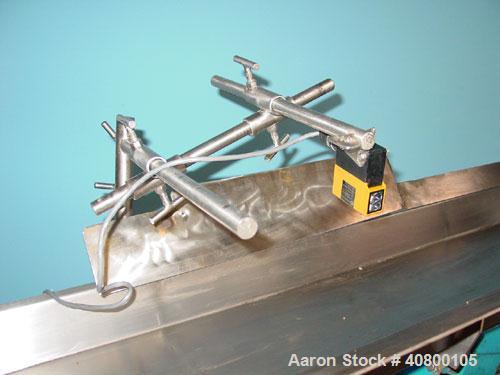Used H Tech Vibratory Conveyor, Stainless Steel. 10-1/2'' Wide x 76'' long x 3'' high sides vibrating pan. Syntron speed controller. Mounted on a carbon steel base.