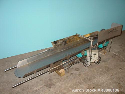 Used H Tech Vibratory Conveyor, Stainless Steel. 10-1/2'' Wide x 74'' long x 3'' high sides vibrating pan. Syntron speed controller. Mounted on a carbon steel base.
