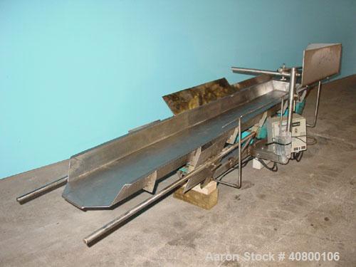 Used H Tech Vibratory Conveyor, Stainless Steel. 10-1/2'' Wide x 74'' long x 3'' high sides vibrating pan. Syntron speed controller. Mounted on a carbon steel base.