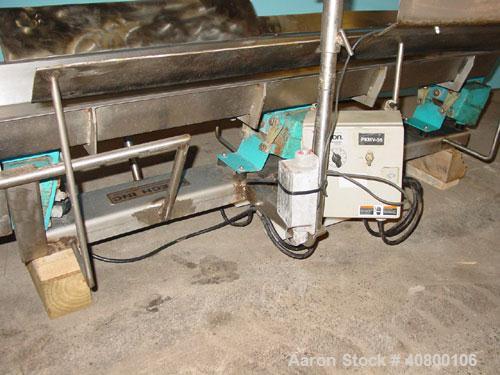 Used H Tech Vibratory Conveyor, Stainless Steel. 10-1/2'' Wide x 74'' long x 3'' high sides vibrating pan. Syntron speed controller. Mounted on a carbon steel base.