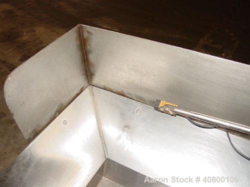Used H Tech Vibratory Conveyor, Stainless Steel. 10-1/2'' Wide x 74'' long x 3'' high sides vibrating pan. Syntron speed controller. Mounted on a carbon steel base.