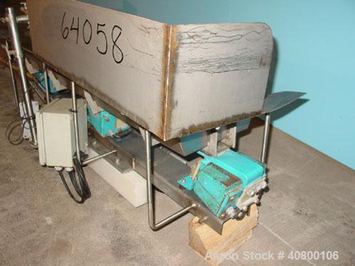 Used H Tech Vibratory Conveyor, Stainless Steel. 10-1/2'' Wide x 74'' long x 3'' high sides vibrating pan. Syntron speed controller. Mounted on a carbon steel base.