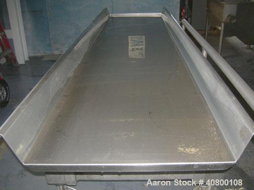 Used Key Technology ISO-FLO Vibratory Conveyor, model 430634-1, 304 stainless steel. Maximum stroke approximately 8". 24" wide x 108" long x 4" deep conveyor pan. End discharge. Driven by an approxim...