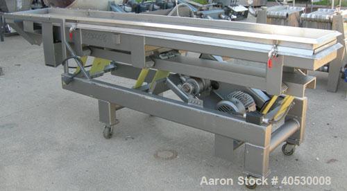 Used Horizontal vibratory conveyor/ screener, 304 stainless steel. Approximately 17" wide x 133' long, double clamp in deck, 3 separation. Top deck 84" long section with 1/4" screen holes, bottom dec...
