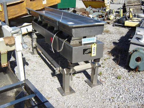 Used Smalley Stainless Vibrating Conveyor. 18" wide x 8' long, 4" deep pan. All stainless steel food grade construction. End discharge height is 35" above ground. Electro-magnetic drive.