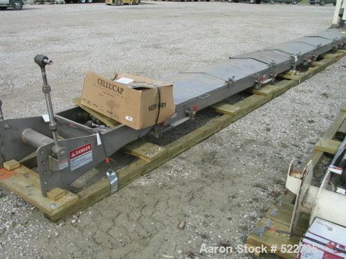 USED: 24" wide x 30' long x 8" deep vibrating conveyor, "slip-stick"design, manufactured by Triple S Dynamics. 304 stainless steel contact, model HDC-8/2.0/LH. Hinged cover. Air actuated slide valves...