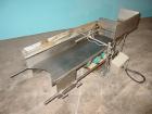 Used H Tech Vibratory Conveyor, stainless steel. 16'' wide x 42'' long x 3'' high sides vibrating pan. Syntron speed controller. Mounted on a carbon steel base.