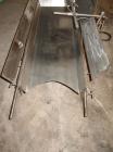Used H Tech Vibratory Conveyor, stainless steel. 16'' wide x 42'' long x 3'' high sides vibrating pan. Syntron speed controller. Mounted on a carbon steel base.