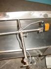 Used H Tech Vibratory Conveyor, stainless steel. 16'' wide x 42'' long x 3'' high sides vibrating pan. Syntron speed controller. Mounted on a carbon steel base.