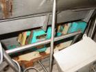 Used H Tech Vibratory Conveyor, stainless steel. 16'' wide x 42'' long x 3'' high sides vibrating pan. Syntron speed controller. Mounted on a carbon steel base.