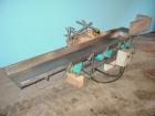 Used H Tech Vibratory Conveyor, Stainless Steel. 10-1/2'' Wide x 76'' long x 3'' high sides vibrating pan. Syntron speed controller. Mounted on a carbon steel base.