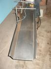 Used H Tech Vibratory Conveyor, Stainless Steel. 10-1/2'' Wide x 76'' long x 3'' high sides vibrating pan. Syntron speed controller. Mounted on a carbon steel base.
