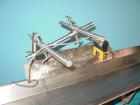 Used H Tech Vibratory Conveyor, Stainless Steel. 10-1/2'' Wide x 76'' long x 3'' high sides vibrating pan. Syntron speed controller. Mounted on a carbon steel base.