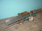Used H Tech Vibratory Conveyor, Stainless Steel. 10-1/2'' Wide x 74'' long x 3'' high sides vibrating pan. Syntron speed controller. Mounted on a carbon steel base.